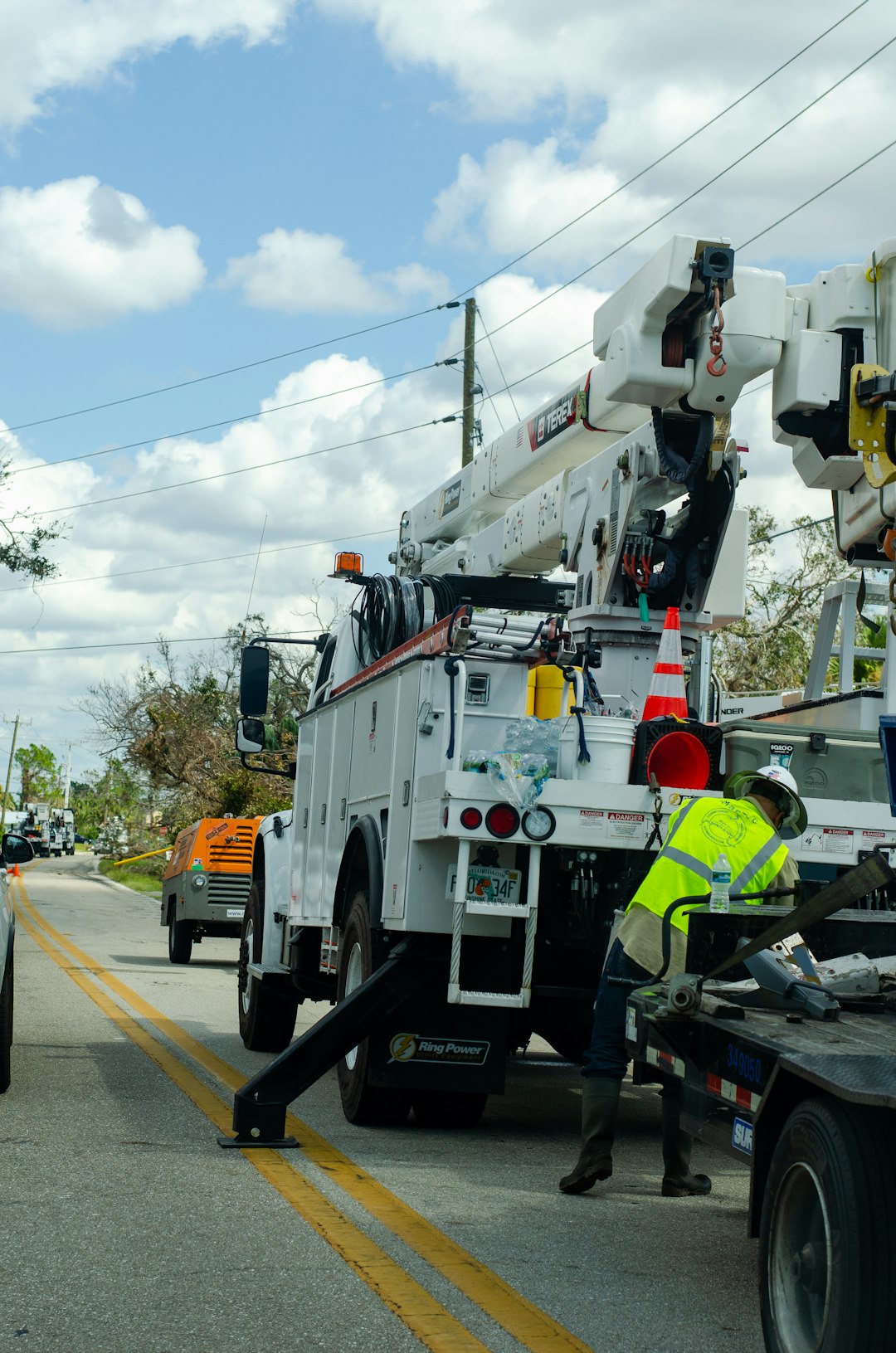 a-white-utility-truck-parked-on-the-side-of-a-road-vn0b-79omye